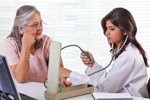 The doctor measures blood pressure in high blood pressure